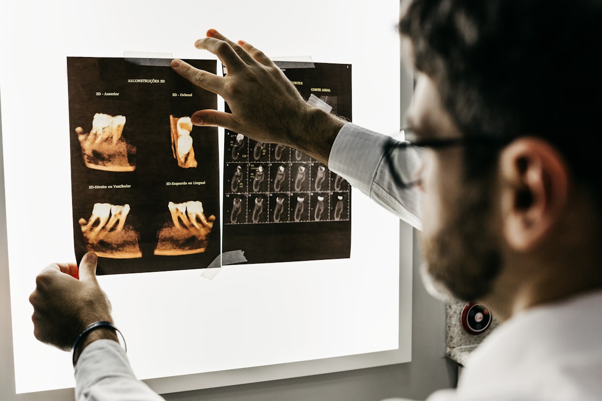 A clinician reviewing a digital dental X-ray